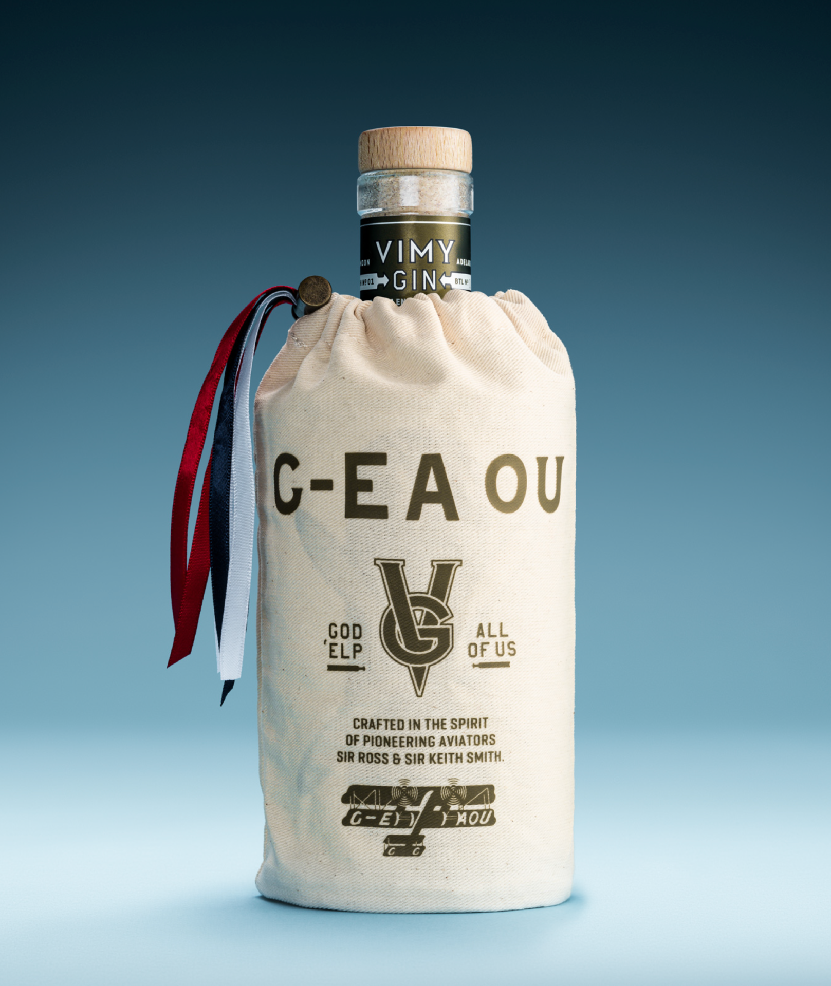 A photograph of the Vimy Gin outer packaging design featuring a custom printed calico bag with brass toggle and ribbon trim. 