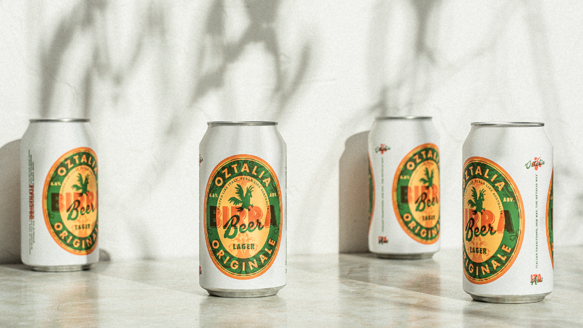 A photograph featuring 4 Oztalia beer cans on a white rendered background.