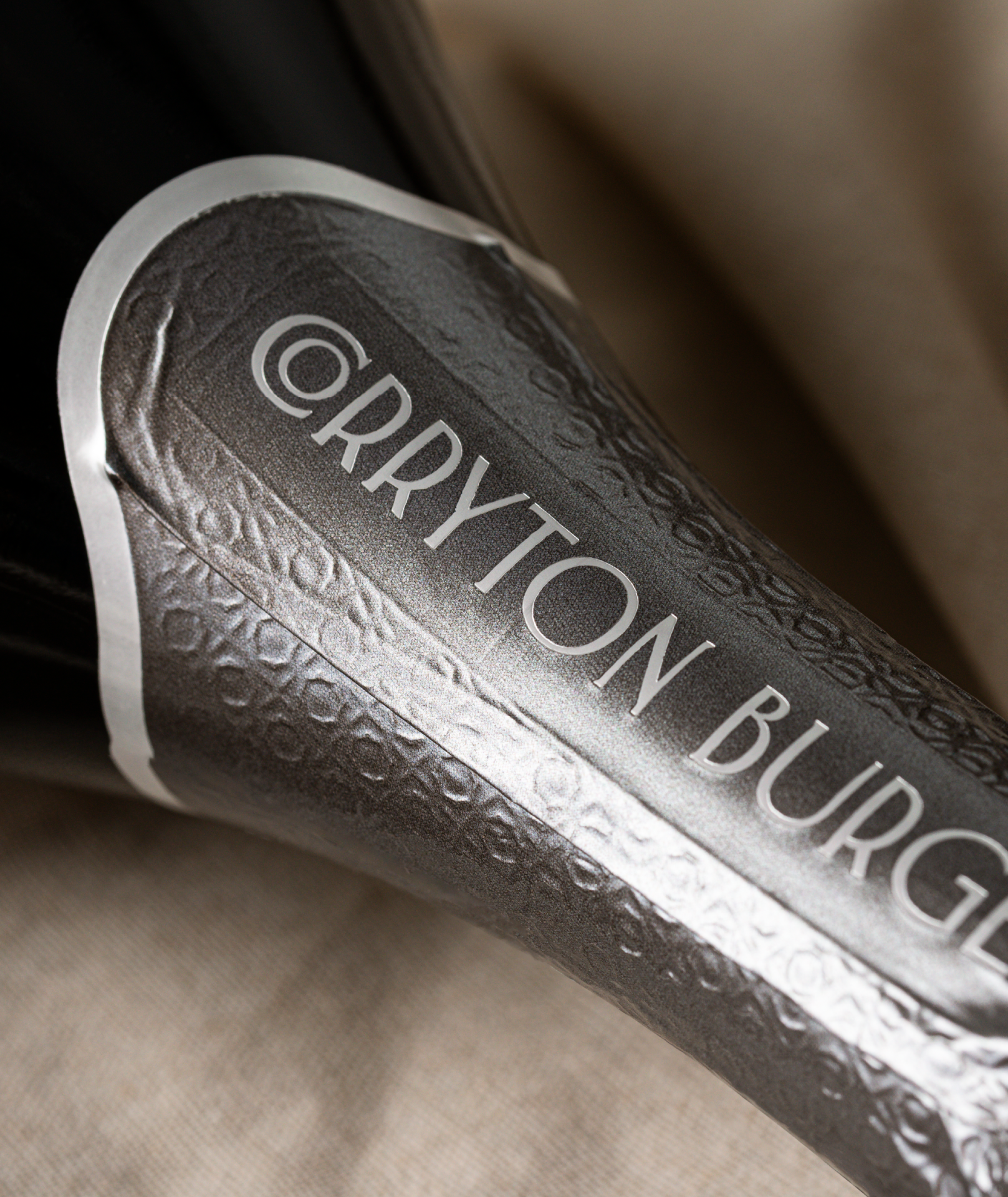 Close up of grey foil hood for Corryton Burge Sparkling Red.