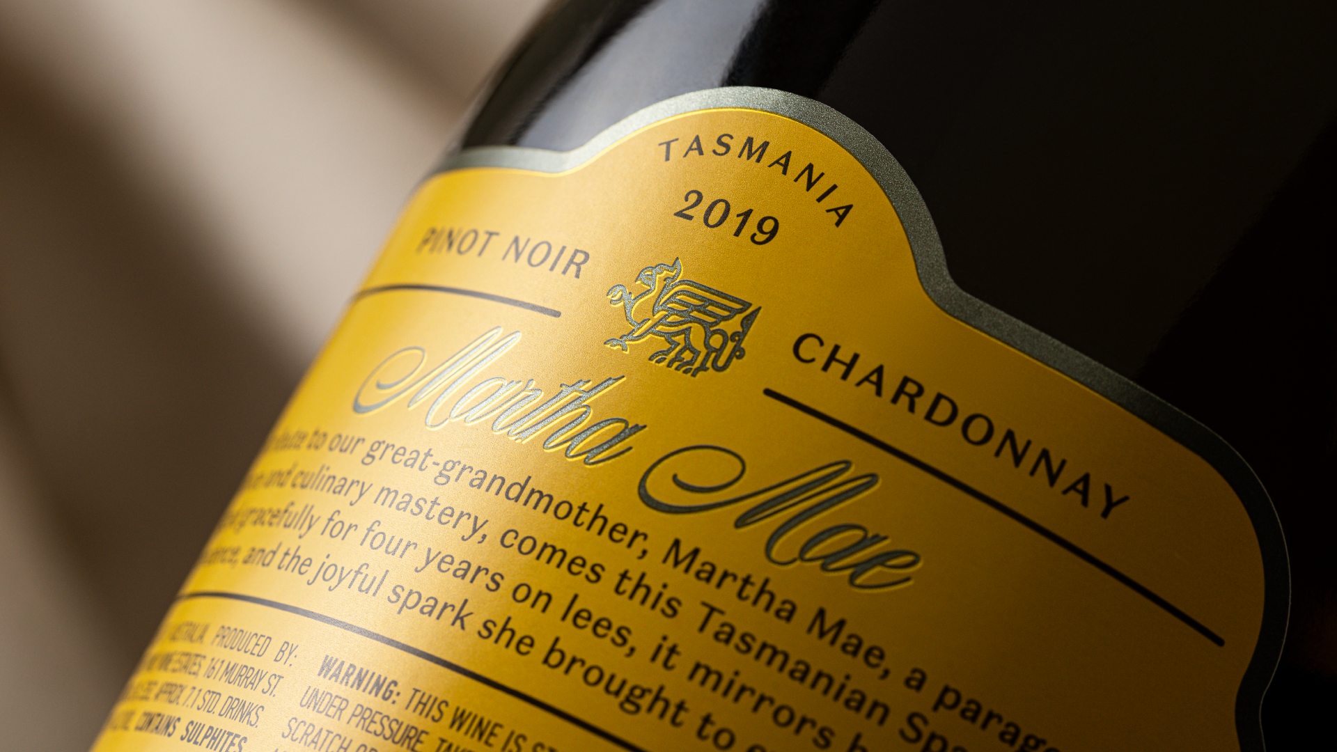 Yellow back label with deboss, foil embellishment for Corryton Burge