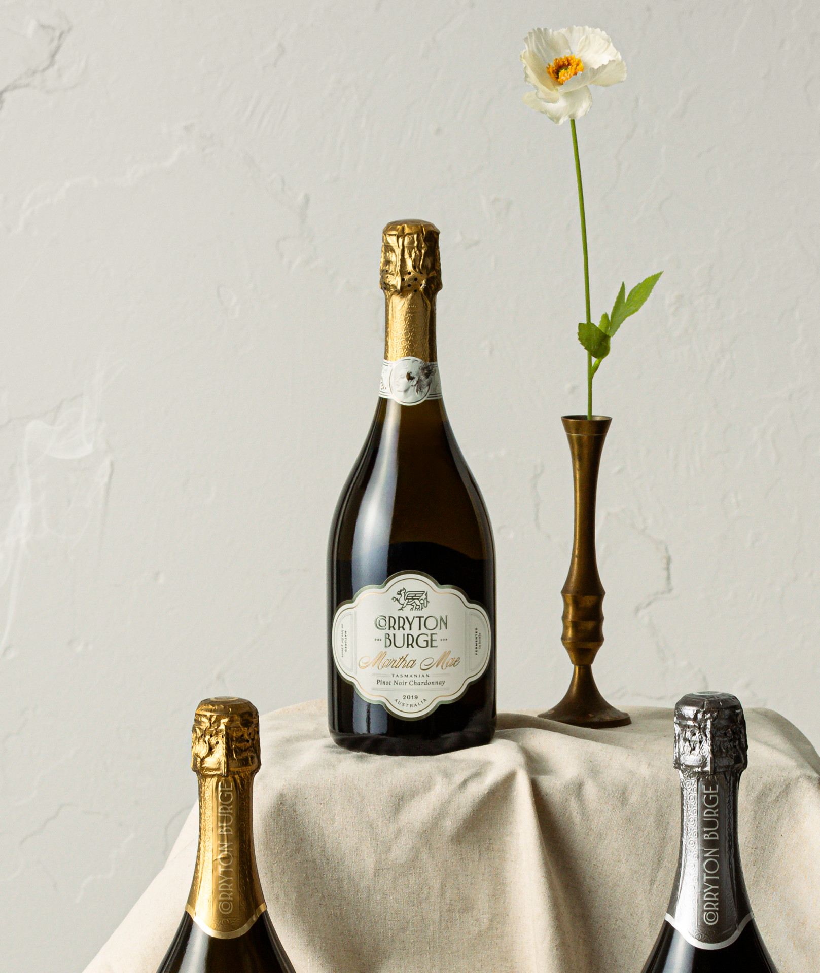 Styled image showing Martha Mae sparkling wine packaging