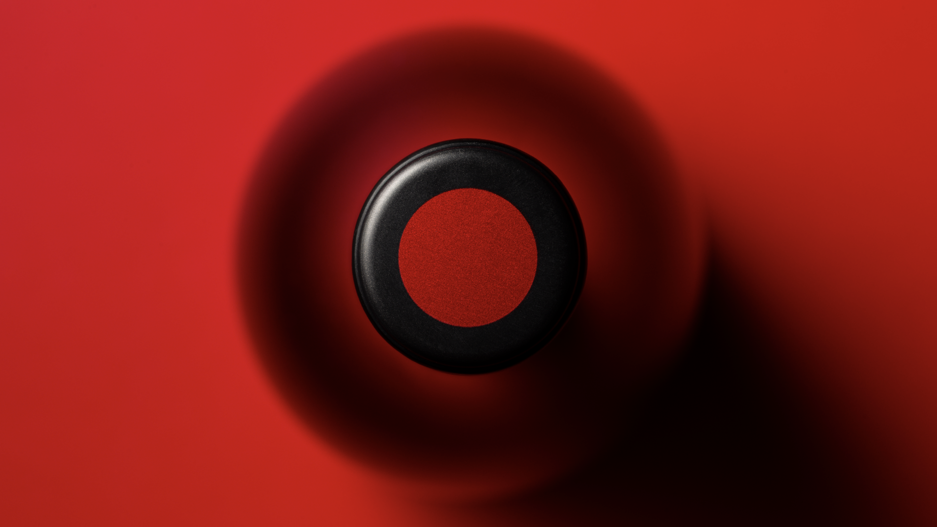 Package design detail showing the red foil dot on the top of the Penny's Hill bottle screw cap.