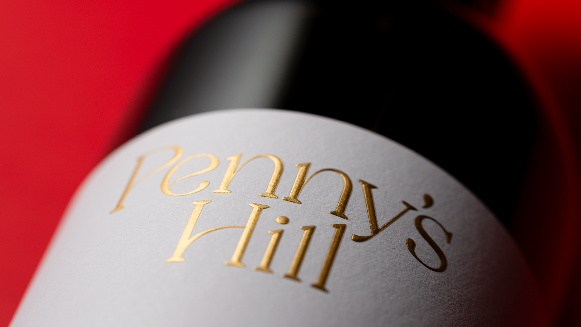 Detailed close up showing the foil and embossed Penny's HIll logotype at the top of the labels.