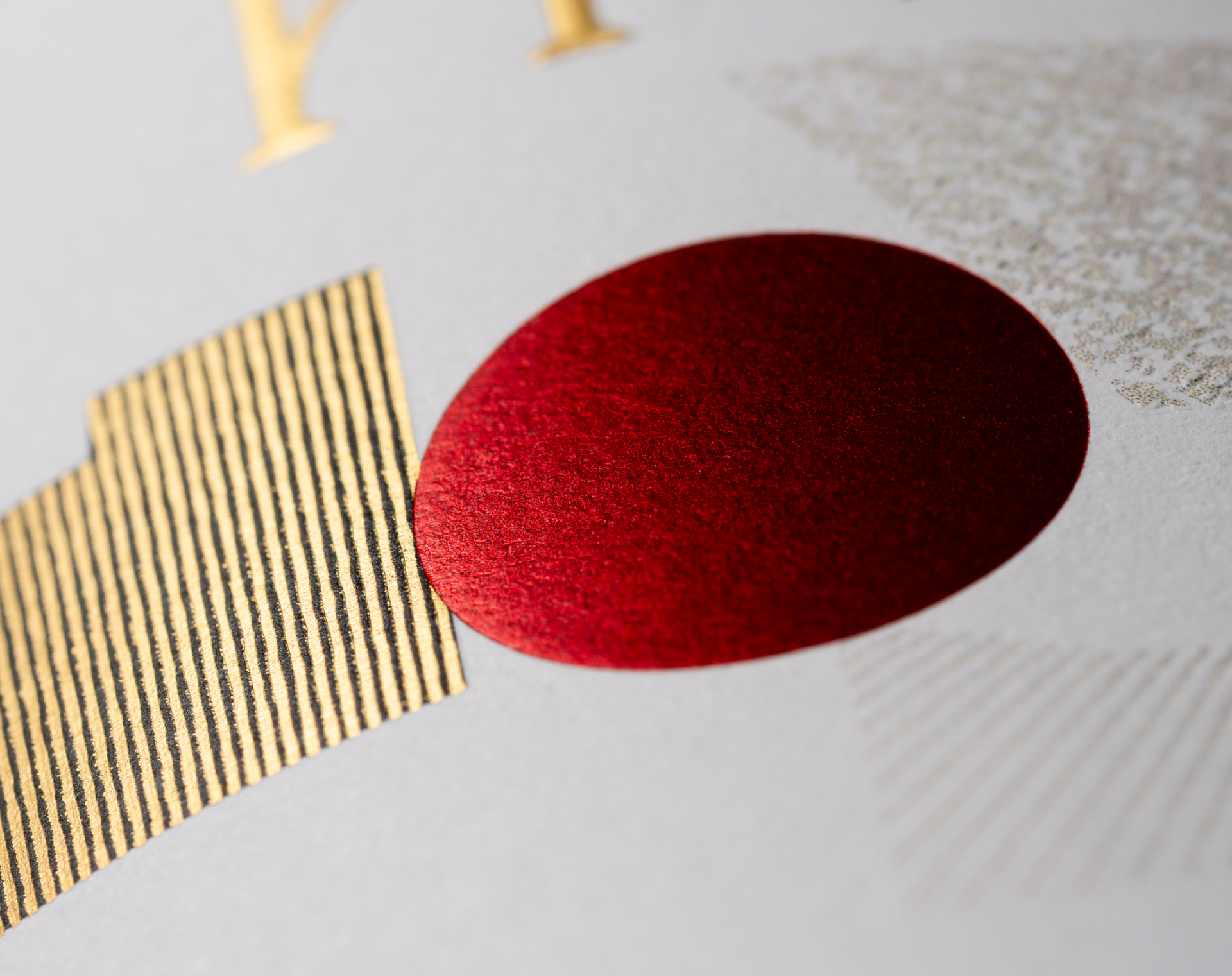 Detailed close up showing the red foil dot and vineyard embellishment from the Grenache label