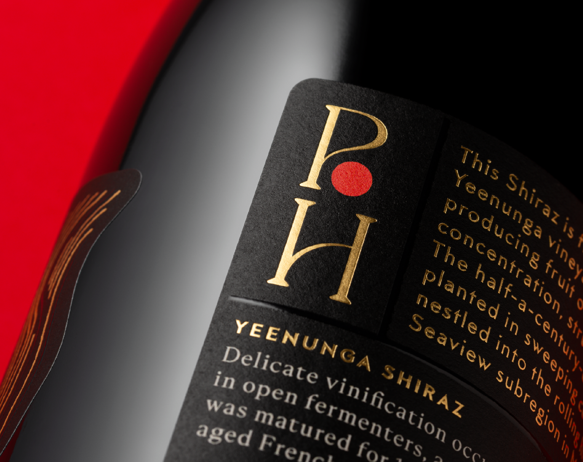Close up of the Yeenunga Shiraz packaging design showing a portion of the back label with gold foil.