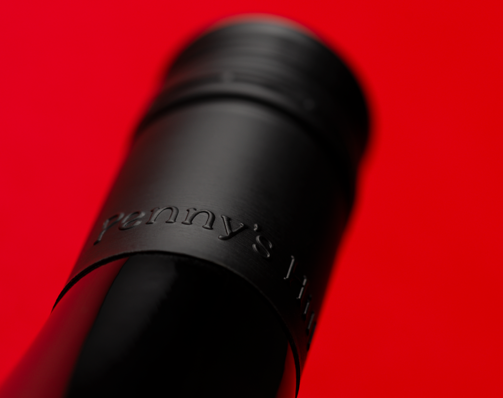 Close up detail of the screw cap bottle closure, with the embossed 'Penny's Hill' text.