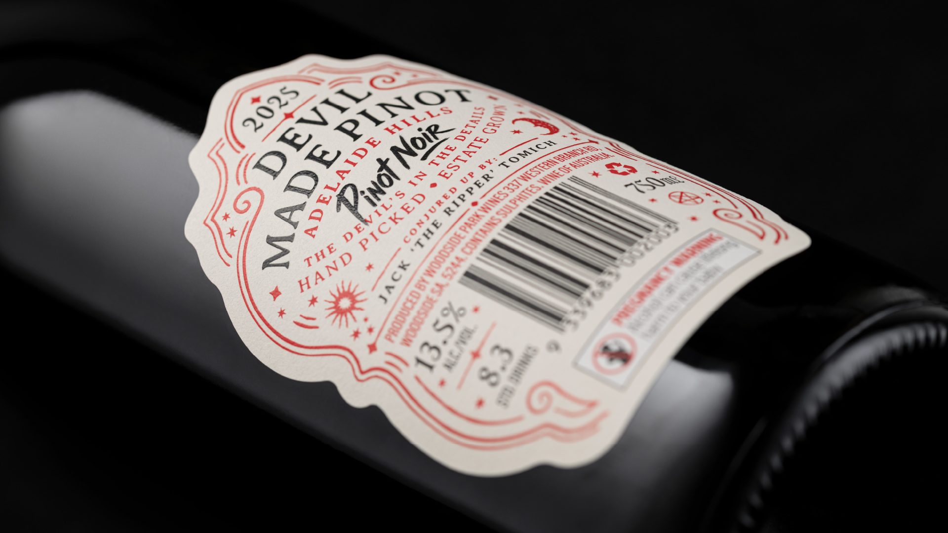 Back label design for The Devil Made Pinot, demonstrating cohesive brand typography, technical layouts, and custom ornamental framing for the Adelaide Hills Pinot Noir.